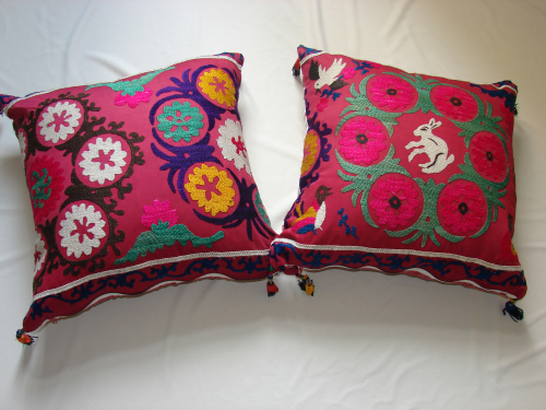 A pair of Suzani cushions c1960