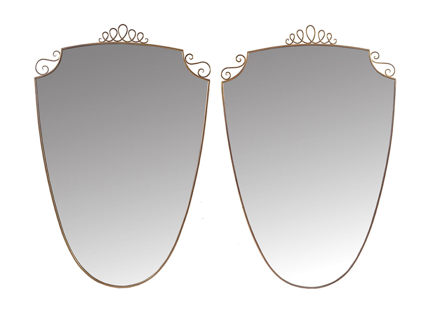 Pair of shield shaped brass mirrors