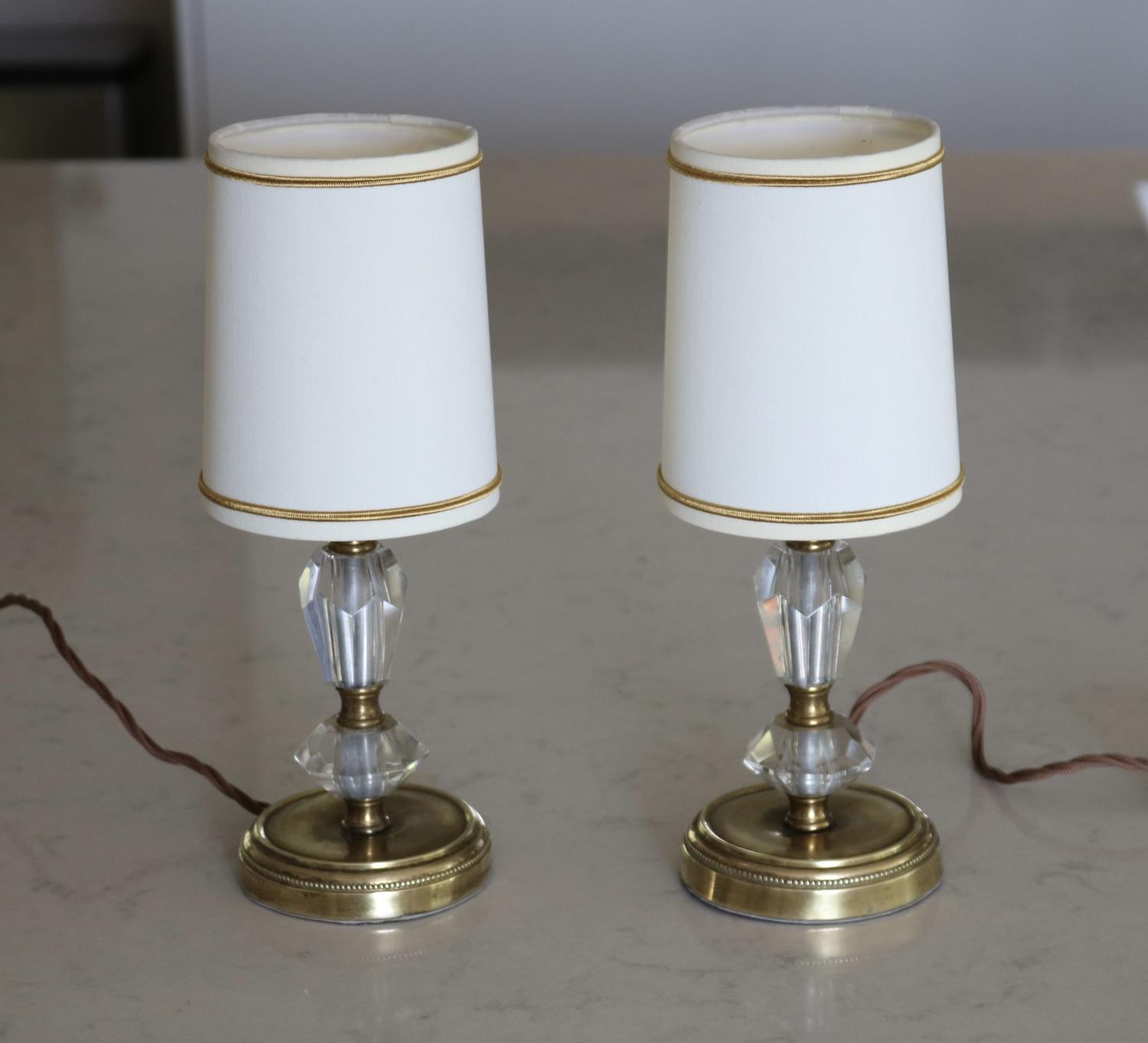 Pair of brass and glass bedside lamps