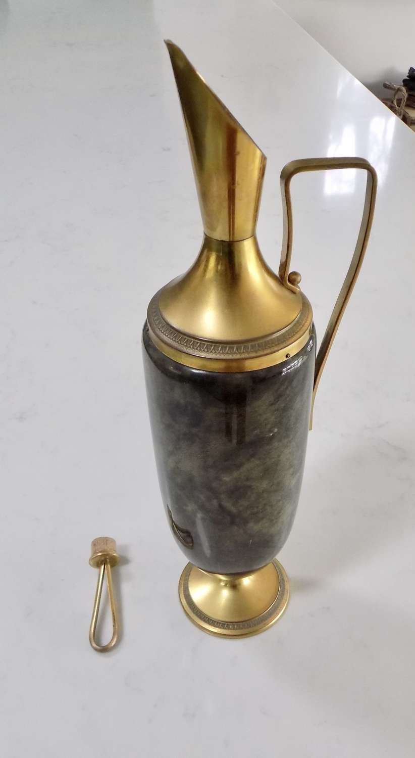Brass and goatskin jug